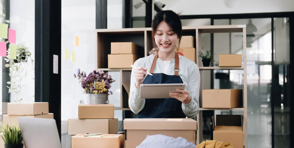 Small start-up business owners using computers at work, freelancers, saleswoman, checking production